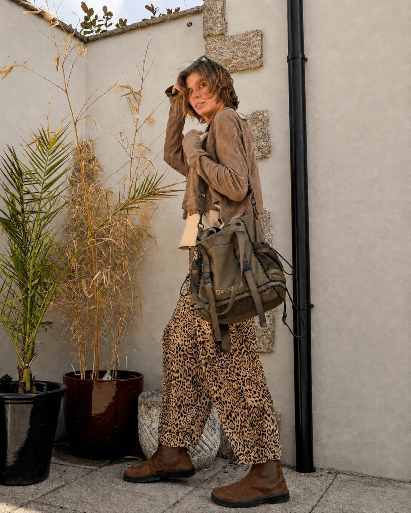        Khaki Desigual Voyager XL multiposition backpack shown without its detachable front pouch and adjustable straps.