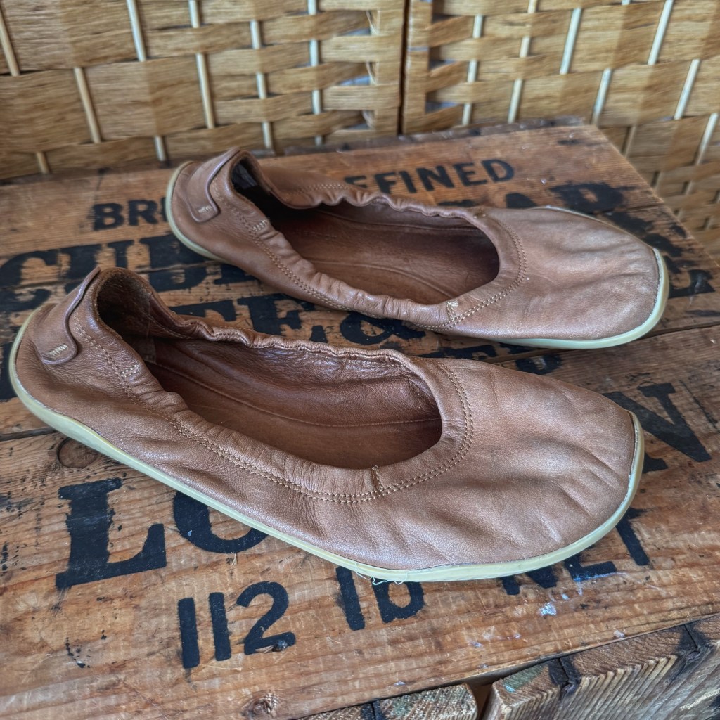 Tan Vivobarefoot Asana Yin barefoot ballet flats with a flexible sole.