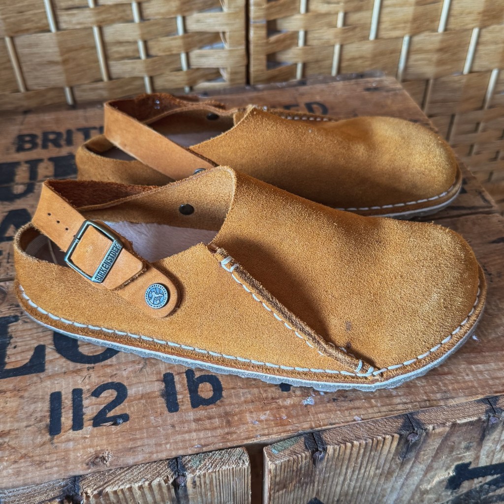Tan Birkenstock Lutry clogs with a wide toe box and adjustable back strap.